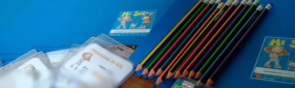 Mi Sol in-text image 2. Pencils and name tags from the programme.